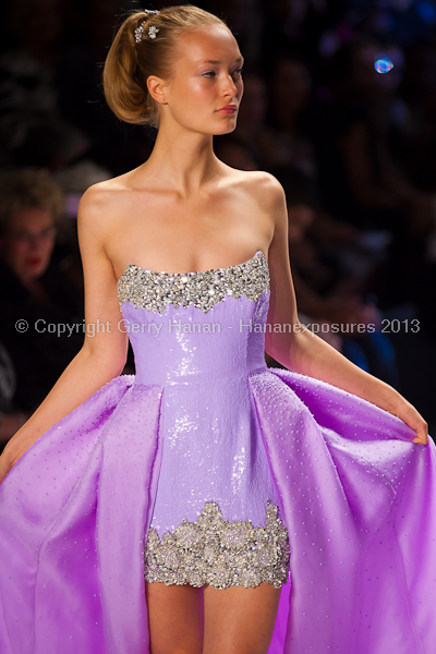 A model on the runway at the Zang Toi SS2013 show at New York Mercedes-Benz Fashion Week.