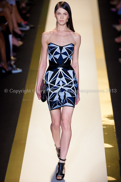 A model on the runway at the Herve Leger SS2013 show at New York Mercedes-Benz Fashion Week.