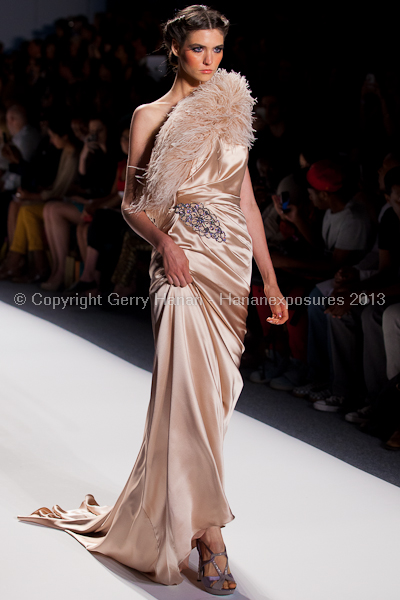 A model on the runway at the Venexiana SS2013 show at New York Mercedes-Benz Fashion Week.